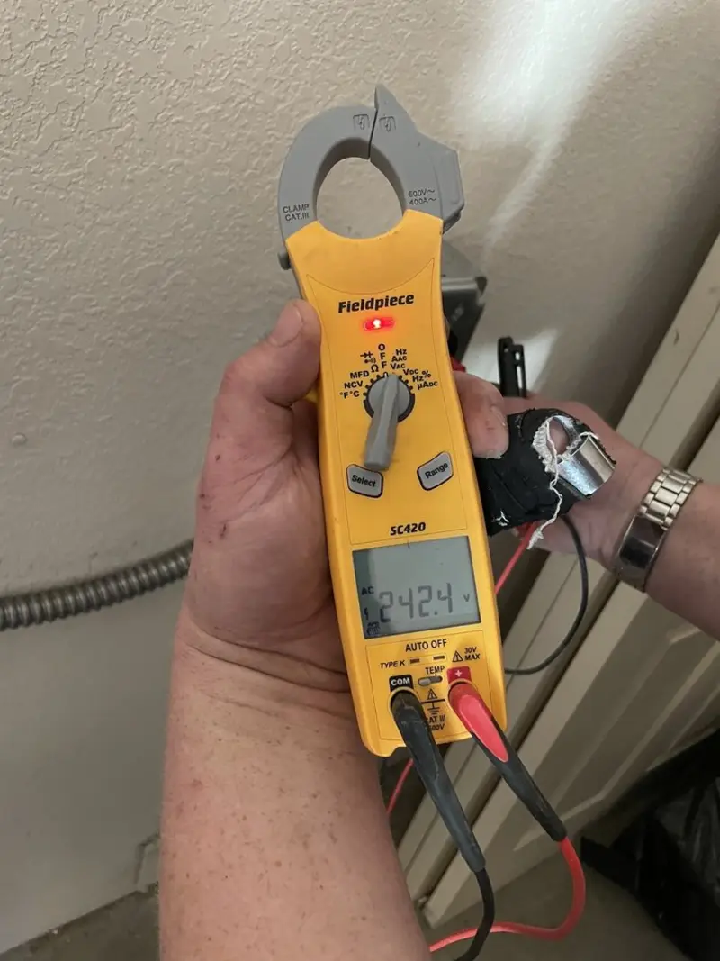 Voltage testing with clamp meter during Outlet Installation in Cave Springs